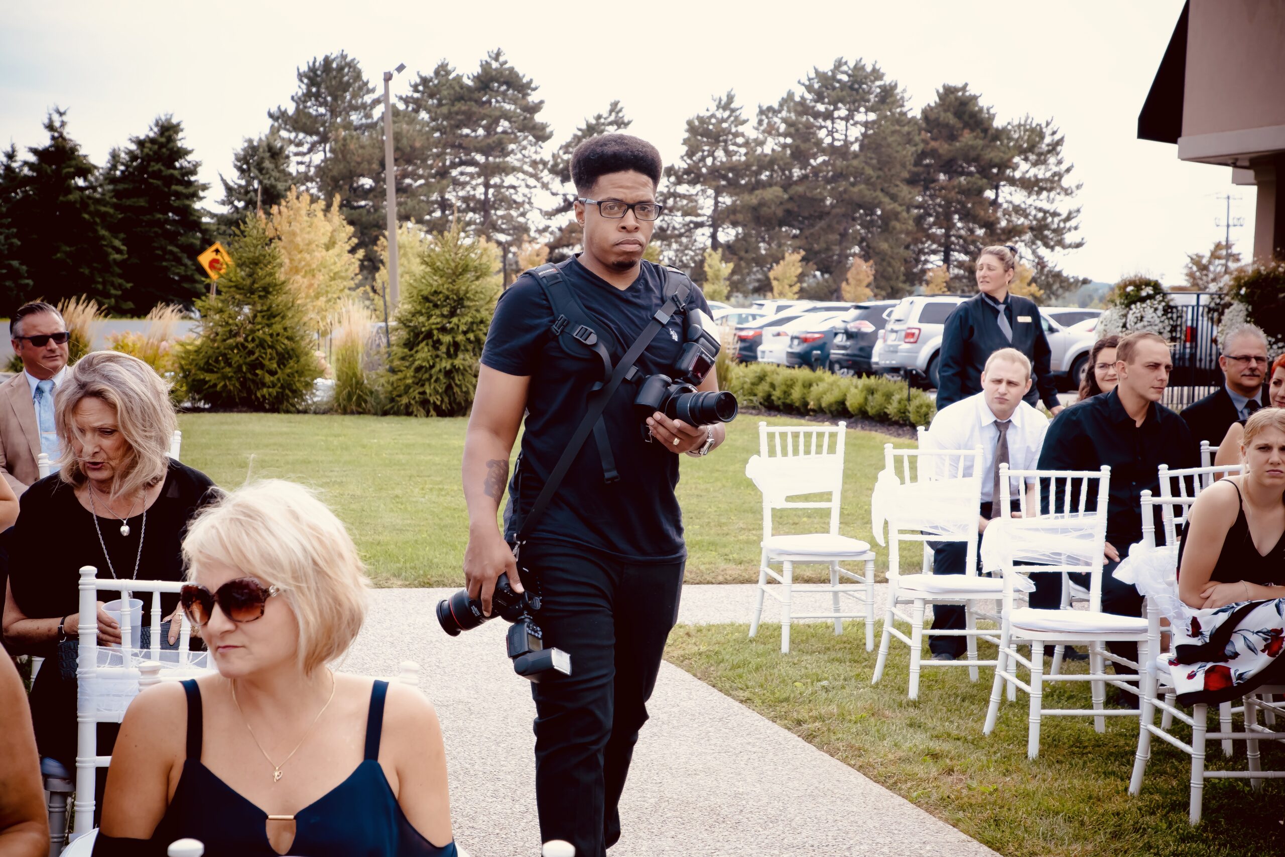 Dwight from Permashine Photography working at a wedding